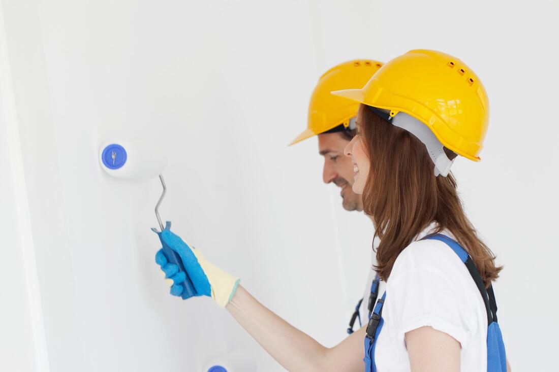 woman using a paint roller